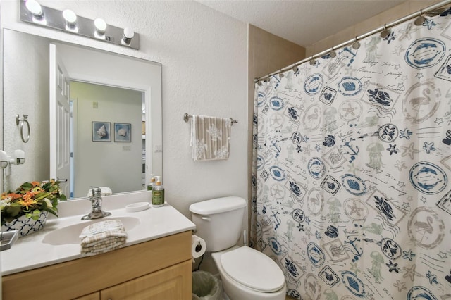 bathroom with a textured wall, toilet, vanity, a textured ceiling, and a shower with curtain