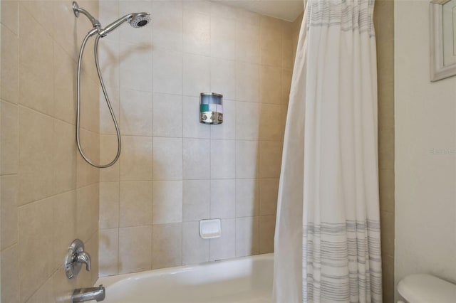 bathroom with shower / bath combination with curtain