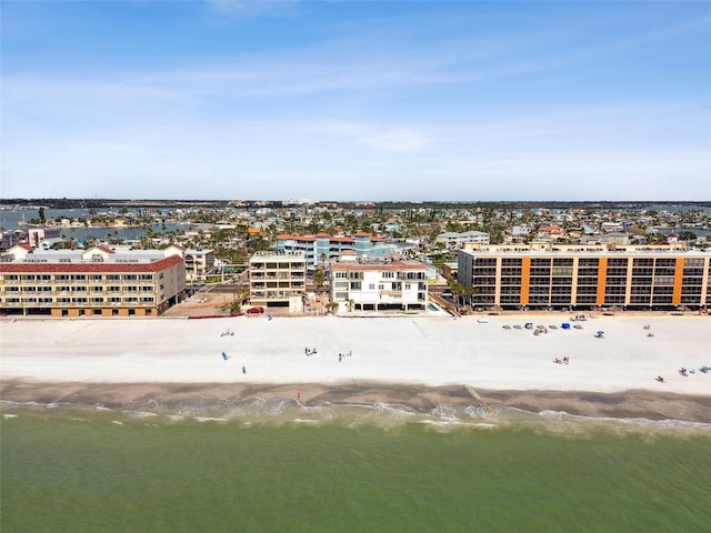 aerial view featuring a water view, a view of the beach, and a city view