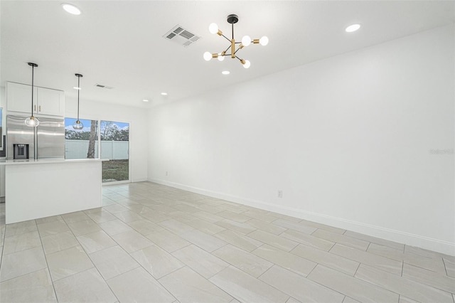 unfurnished living room featuring an inviting chandelier, baseboards, visible vents, and recessed lighting