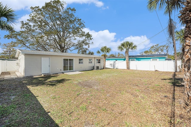 view of yard with a fenced backyard and cooling unit