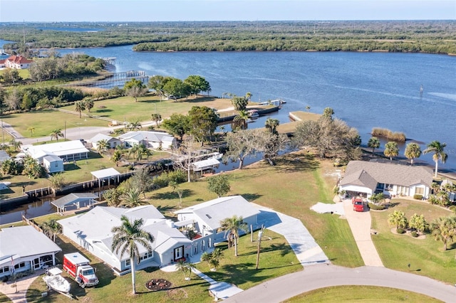 birds eye view of property with a water view and a residential view