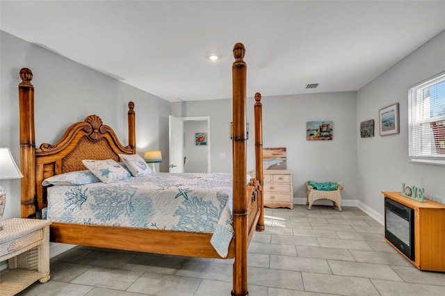 bedroom with visible vents and baseboards