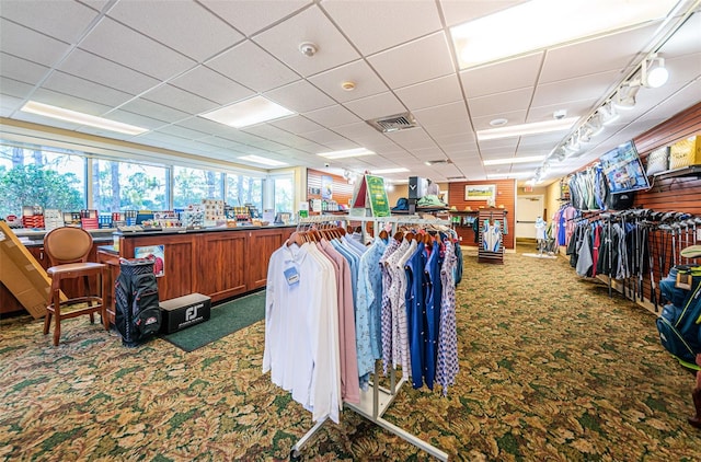 miscellaneous room with a paneled ceiling, carpet, and visible vents