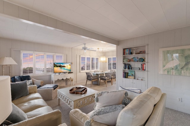 living room featuring a ceiling fan and light colored carpet