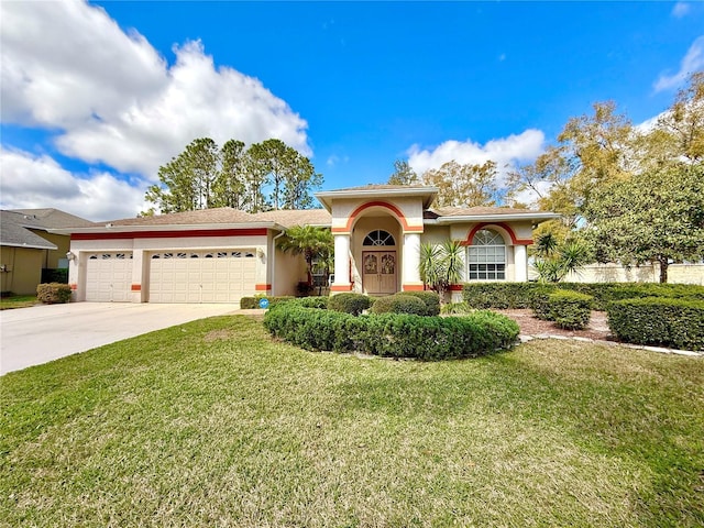 ranch-style home featuring a garage, a front yard, driveway, and stucco siding