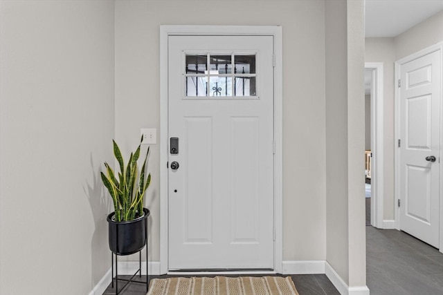 foyer entrance with baseboards