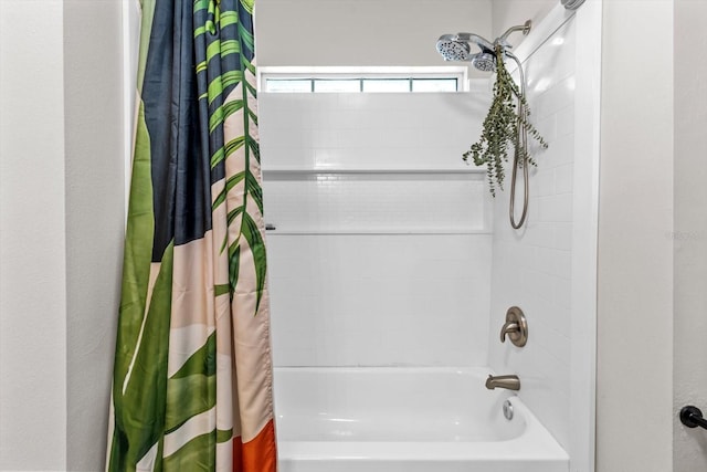 bathroom with shower / tub combo with curtain