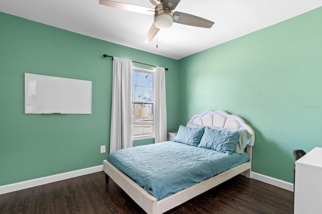 bedroom featuring dark wood-style flooring, ceiling fan, and baseboards