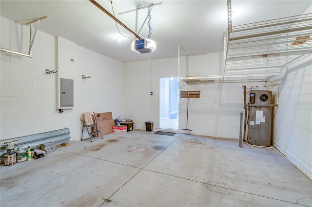 garage with concrete block wall, heat pump water heater, electric panel, and a garage door opener