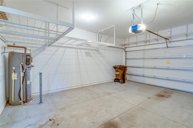 garage featuring hybrid water heater and a garage door opener