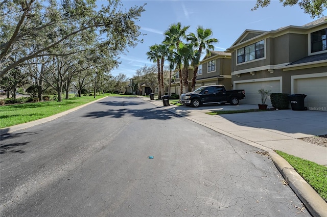 view of street with a residential view and curbs