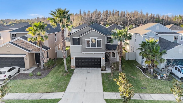 traditional-style home with driveway, a residential view, a front lawn, and stucco siding