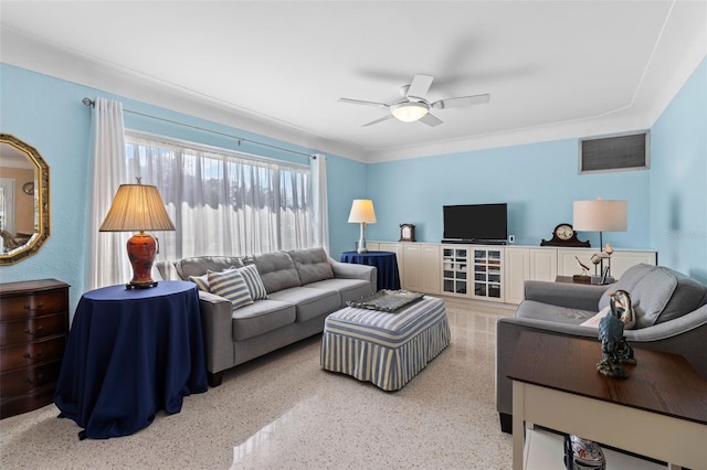 living room with ceiling fan, visible vents, and light speckled floor