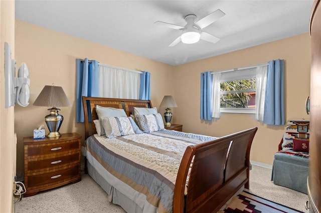 bedroom featuring ceiling fan and baseboards