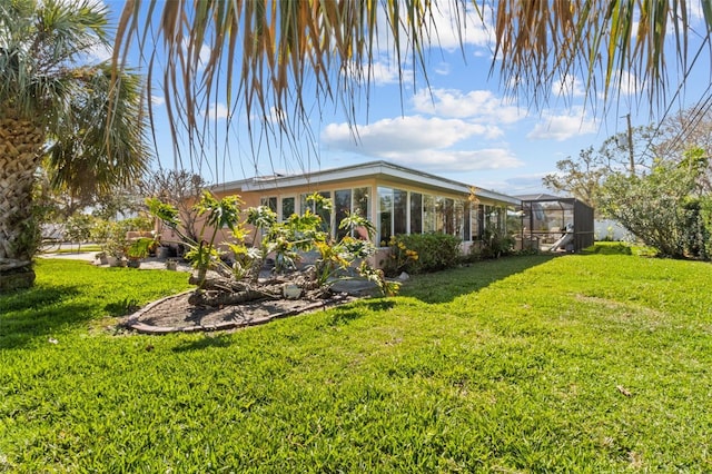 view of yard featuring a lanai