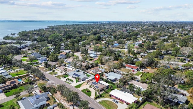 bird's eye view featuring a water view and a residential view