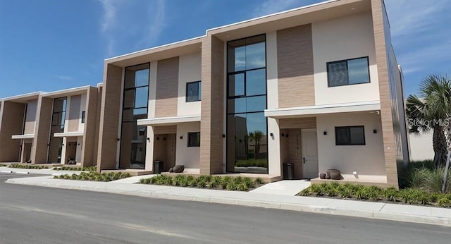 contemporary home featuring stucco siding