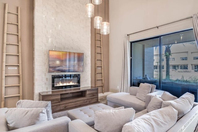 living room featuring built in features and a large fireplace