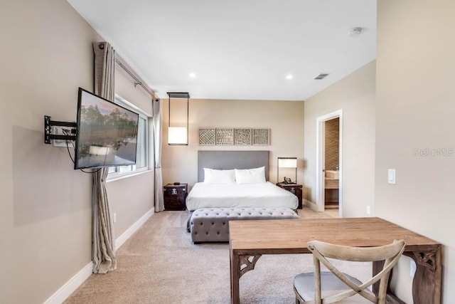 bedroom featuring recessed lighting, light colored carpet, visible vents, baseboards, and ensuite bath