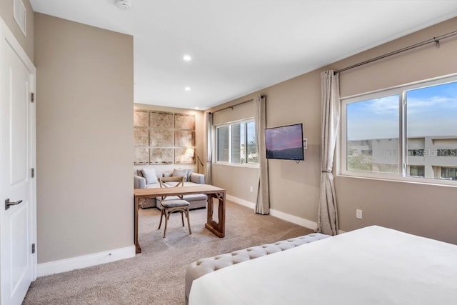 bedroom featuring recessed lighting, light colored carpet, visible vents, and baseboards