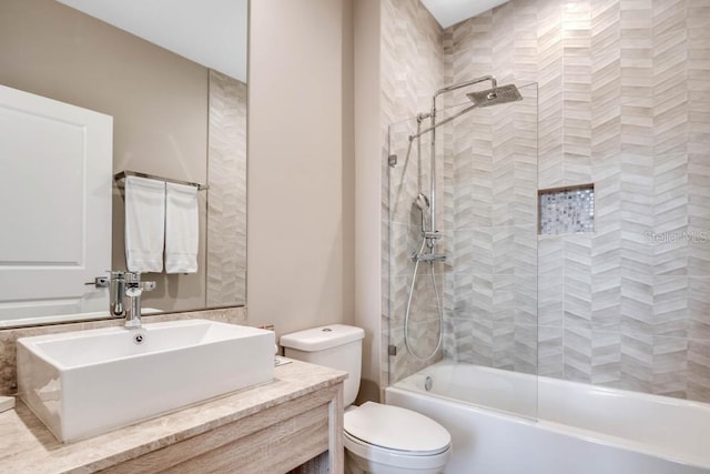 bathroom with shower / tub combination, vanity, and toilet