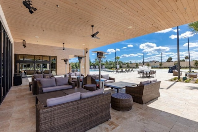 view of patio with ceiling fan, outdoor dining space, and outdoor lounge area