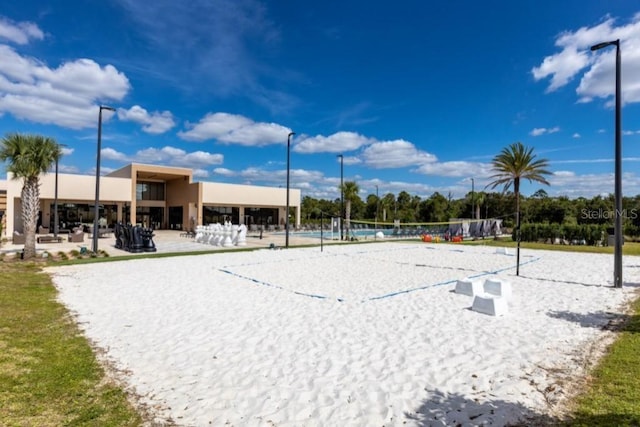 view of home's community featuring volleyball court