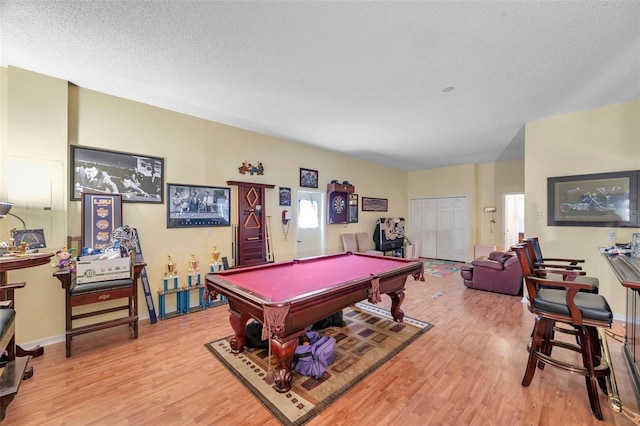 rec room with light wood-style flooring, billiards, baseboards, and a textured ceiling