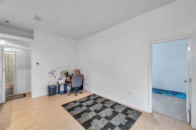 office featuring light wood-style flooring and visible vents