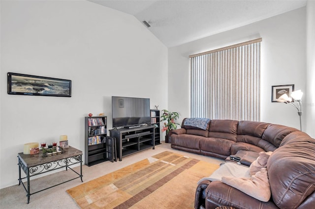 living room with light carpet, visible vents, and lofted ceiling