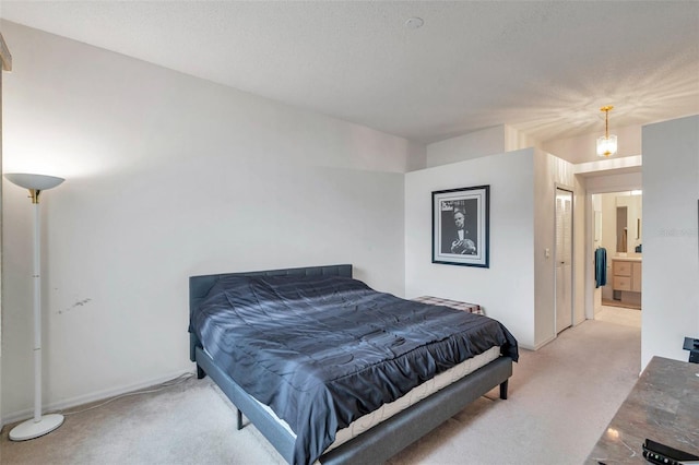 carpeted bedroom featuring connected bathroom