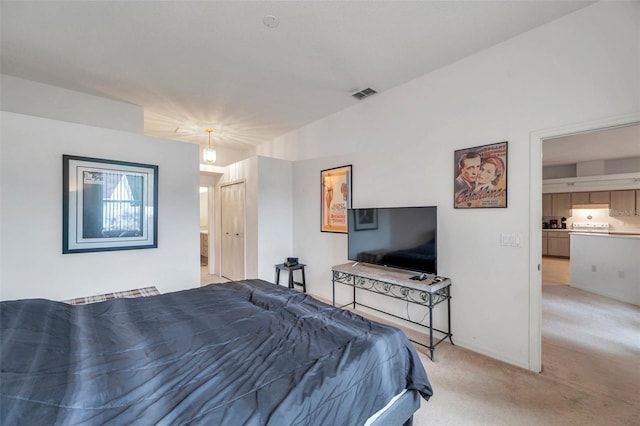 bedroom featuring light carpet and visible vents