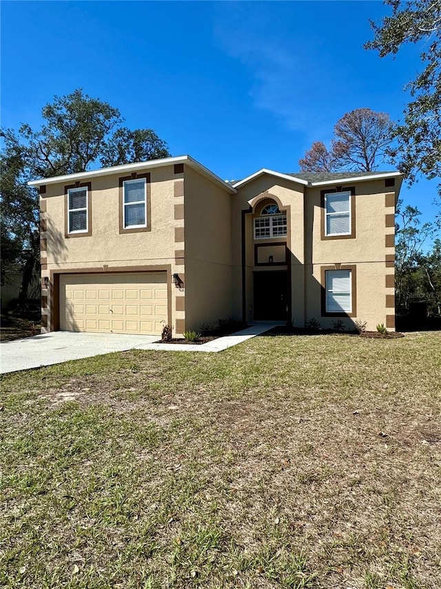 view of front of property featuring stucco siding, a front yard, a garage, and driveway