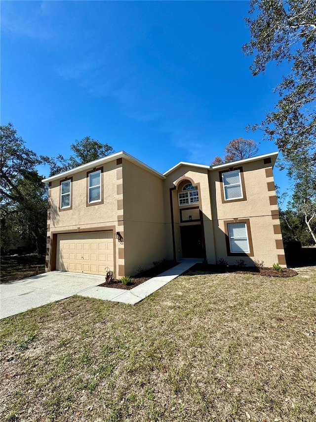 view of front of home featuring stucco siding, an attached garage, driveway, and a front lawn