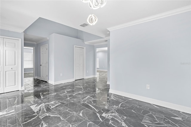 empty room with visible vents, baseboards, marble finish floor, and ornamental molding