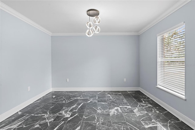 unfurnished room featuring marble finish floor, crown molding, and baseboards