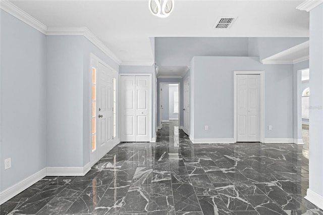 entrance foyer with baseboards, visible vents, marble finish floor, and ornamental molding