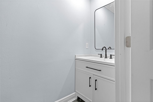 bathroom featuring vanity and baseboards