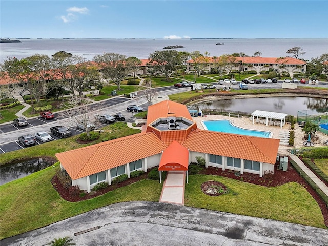 birds eye view of property with a water view