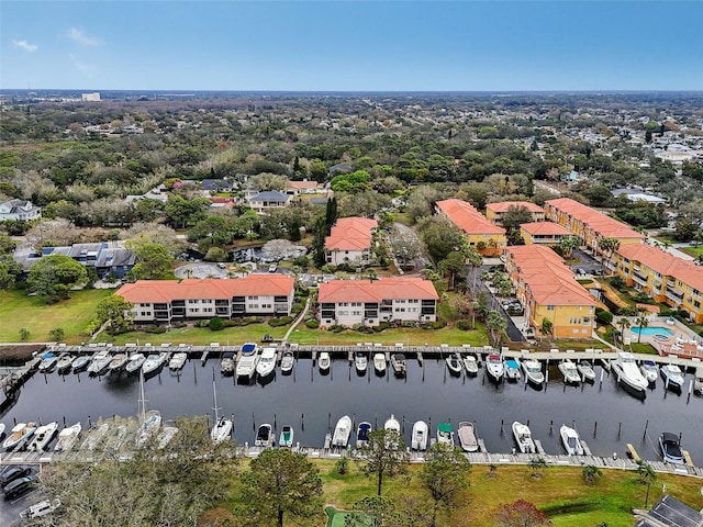 drone / aerial view featuring a water view and a residential view