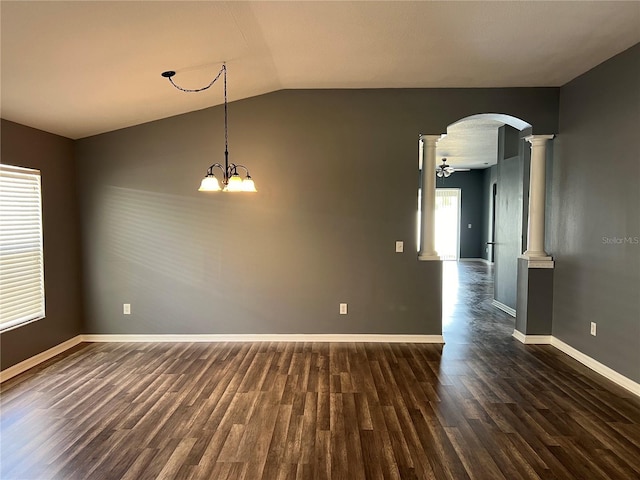 unfurnished room with baseboards, arched walkways, lofted ceiling, dark wood-style flooring, and ornate columns