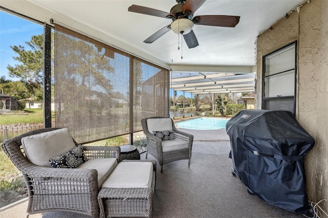 sunroom / solarium with ceiling fan