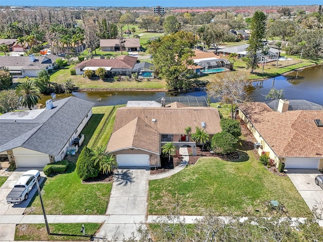 bird's eye view with a residential view and a water view