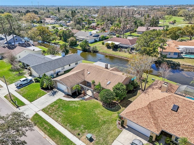 aerial view featuring a residential view and a water view