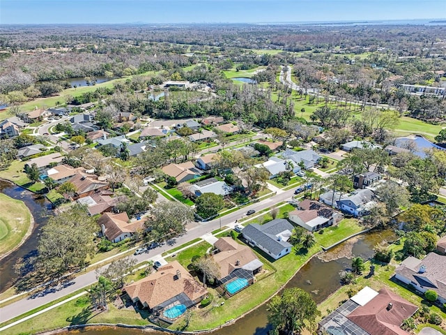 bird's eye view with a residential view and a water view