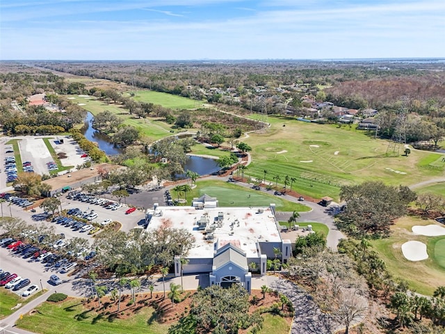 aerial view with view of golf course and a water view