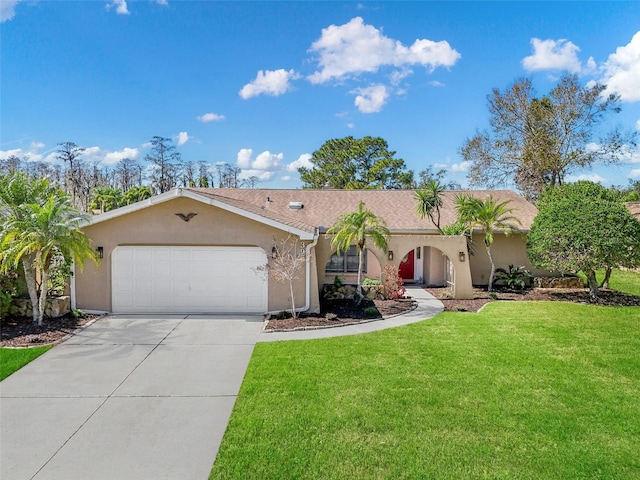 single story home featuring a garage, a front yard, concrete driveway, and stucco siding