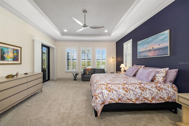 bedroom with recessed lighting, a raised ceiling, light colored carpet, ornamental molding, and access to outside