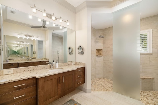 full bathroom with a ceiling fan, a walk in shower, crown molding, and vanity